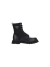 Prada Logo-plaque Panelled Ankle Boots In Black