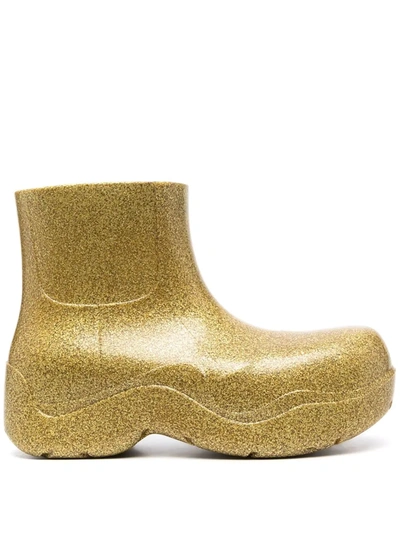 Bottega Veneta Puddle Ankle Boot In Rubber With Glitter In Gold