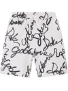 Dolce & Gabbana All-over Logo Print Shorts In White