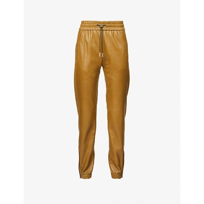 Saint Laurent Womens Mordore Tapered Mid-rise Leather Jogging Bottoms 6 In Yellow
