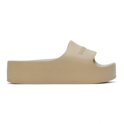 Balenciaga Logo-embossed Rubber Flatform Slides In Taupe