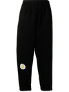 Natasha Zinko Daisy-print Distressed Cotton-blend Sweatpants In Black
