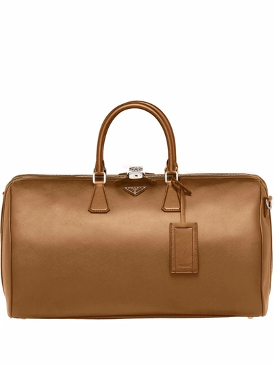 Prada Logo Plaque Duffle Bag In Brown