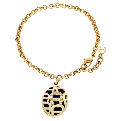 Pre-owned Aigner Gold Tone Enamel & Crystal Logo Charm Bracelet