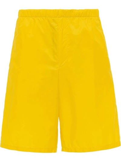 Prada Logo-plaque Knee-length Shorts In Yellow