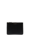 Comme Des Garçons Debossed Logo Zipped Wallet In Black