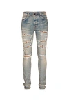 Amiri 15cm Mx1 Playboy Tapered Denim Jeans In Clay Indigo