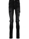 Amiri Mx1 Skinny-fit Panelled Distressed Jeans In Black Od