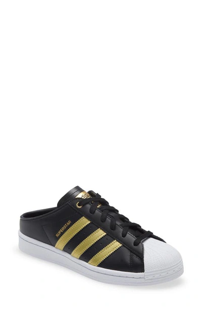 Adidas Originals Superstar Mule Sneaker In Black/ Gold / White
