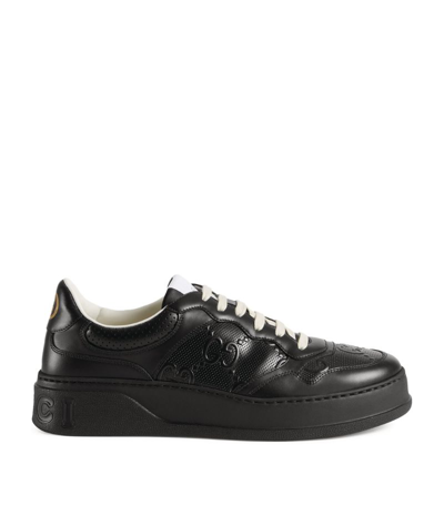 Gucci Gg-embossed Leather Flatform Trainers In Black