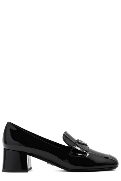 Prada Logo Plaque Heeled Loafers In Black