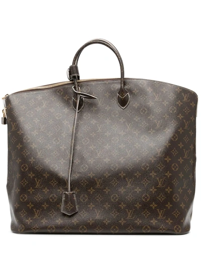 Pre-owned Louis Vuitton 2011  Monogram Lockit Voyage Handbag In Brown