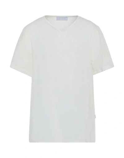 C. 9. 3 T-shirts In White