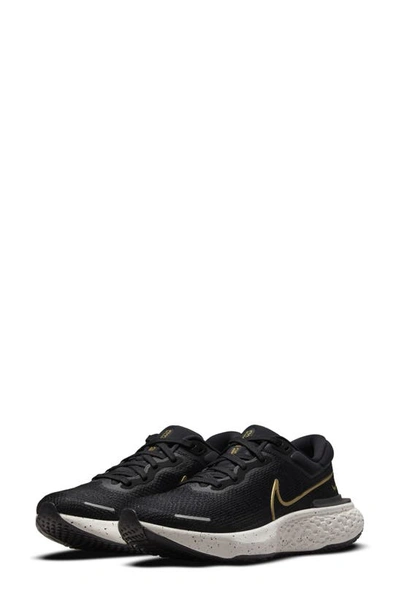 Nike Zoomx Invincible Run Flyknit Trainers In Black/metallic Gold