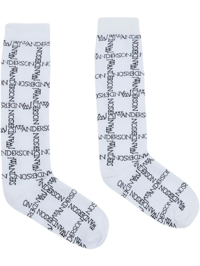 Jw Anderson Intarsia-logo Long Ankle Socks In White Black