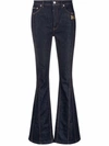 DOLCE & GABBANA FLARED JEANS WITH LOGO PLAQUE