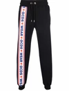 Gcds Jogging Pants With Cute Tape Logo Band In Black