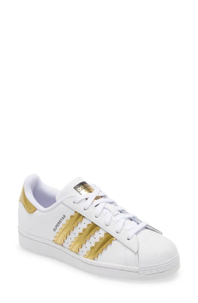 Adidas Originals Superstar Metallic Striped Leather Trainers In White/matte Gold/core Black