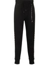 MASTERMIND JAPAN WORLD LEOPARD PRINT TRACK PANTS