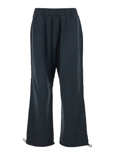 44 LABEL GROUP BLACK PANTS WITH ELASTIC WAIST AND DRAWSTRING HEM IN TECH FABRIC MAN