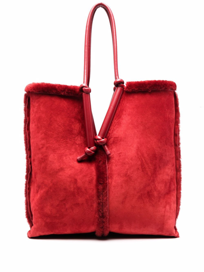Bottega Veneta Bolster Reversible Shearling Suede Bag In Red