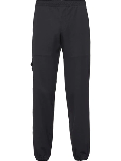 Prada Tapered-leg Virgin Wool Trousers In Black