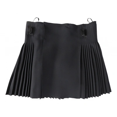 Pre-owned Dior Wool Mini Skirt In Black