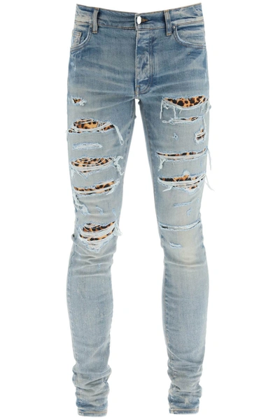 Amiri Leopard Thrasher Cotton Denim Jeans In Clay Indigo