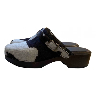 Pre-owned Re/done Pony-style Calfskin Mules & Clogs In Black