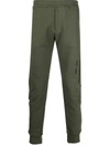 ALEXANDER MCQUEEN LOGO PRINT TAPERED TRACK TROUSERS