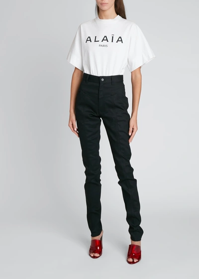 Alaïa Slim-leg Denim Pants W/ Corset Belt Detail In Noir Alaia