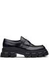 Prada Tread Sole Triangular Logo Plaque Leather Penny Loafers In Black