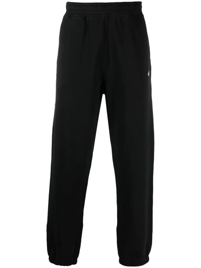 Stussy Stock Logo-print Tapered Cotton-jersey Jogging Bottoms In Black
