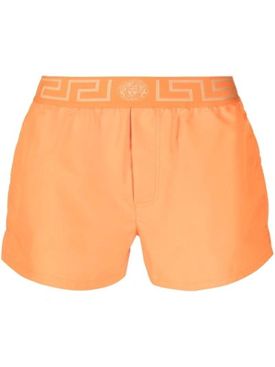 Versace Greca Border Swim Shorts In Orange