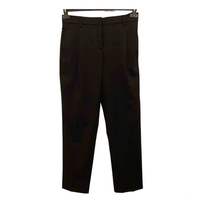Pre-owned Valentino Wool Trousers In Black