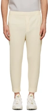 Issey Miyake Pleated Relaxed-fit Tapered Woven Trousers In Vanilla Beige
