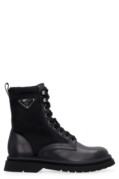 Prada Logo-plaque Panelled Ankle Boots In Black