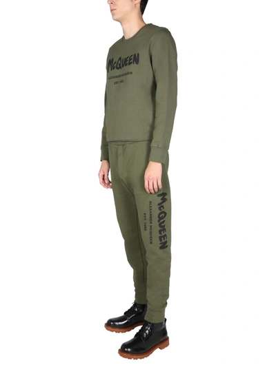 Alexander Mcqueen Men's Jogging Pants With Graffiti Logo In Brown