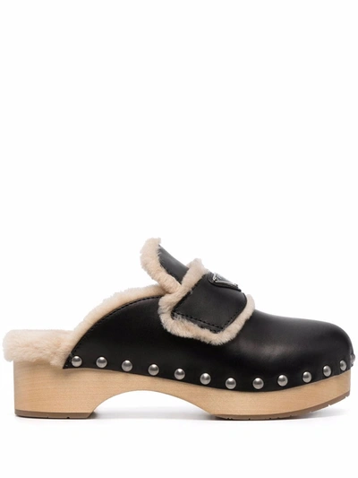 Prada Shearling-lined Leather Clogs In Black