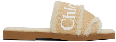 Chloé Woody Shearling-trimmed Logo-print Canvas Slides In Soft Tan