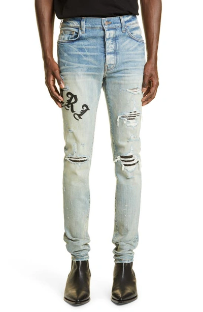 Amiri Skinny-fit Appliquéd Panelled Distressed Jeans In Clay Indigo