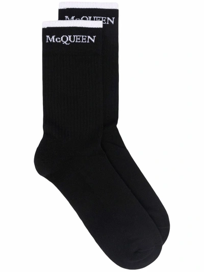 Alexander Mcqueen Ribbed Logo-intarsia Socks In Black
