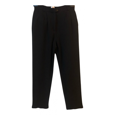 Pre-owned Des Petits Hauts Trousers In Black