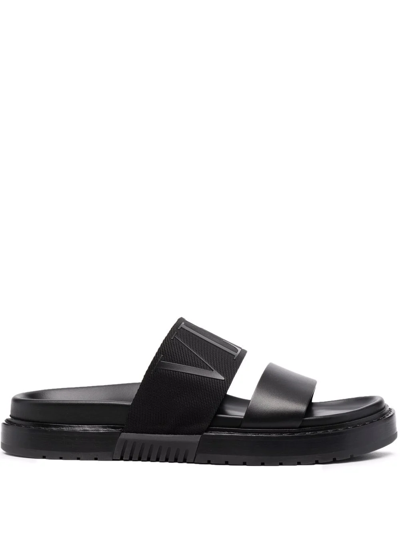 Valentino Garavani Logo-embossed Leather Slides In Black