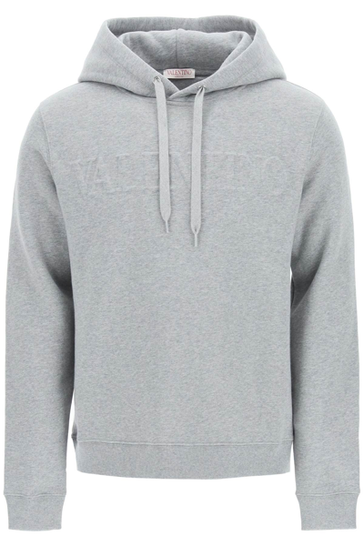 Valentino Logo Embossed Long-sleeved Hoodie In Grey