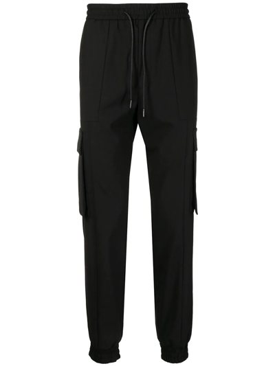 Juunj Relaxed Wool-blend Track Pants In Schwarz