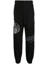 UNDERCOVERISM GRAPHIC-PRINT TRACK PANTS