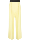 Msgm Logo-waistband Flared Trousers In Yellow