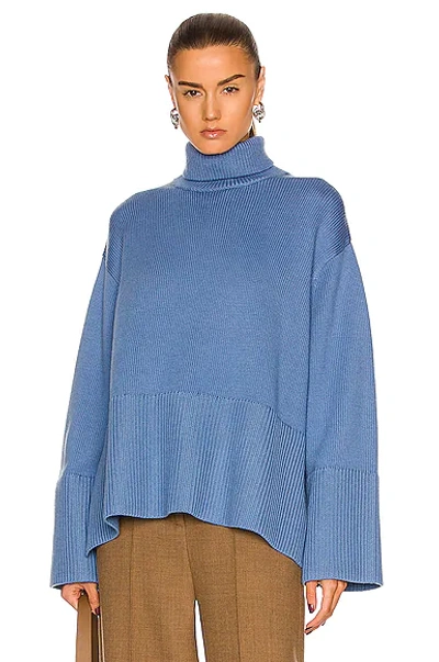 Totême Ribbed Wool And Organic Cotton-blend Turtleneck Sweater In Blue