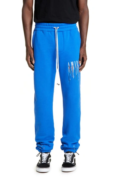 Amiri Paint Drip Relaxed-fit Straight-leg Cotton-jersey Jogging Bottoms In Blue